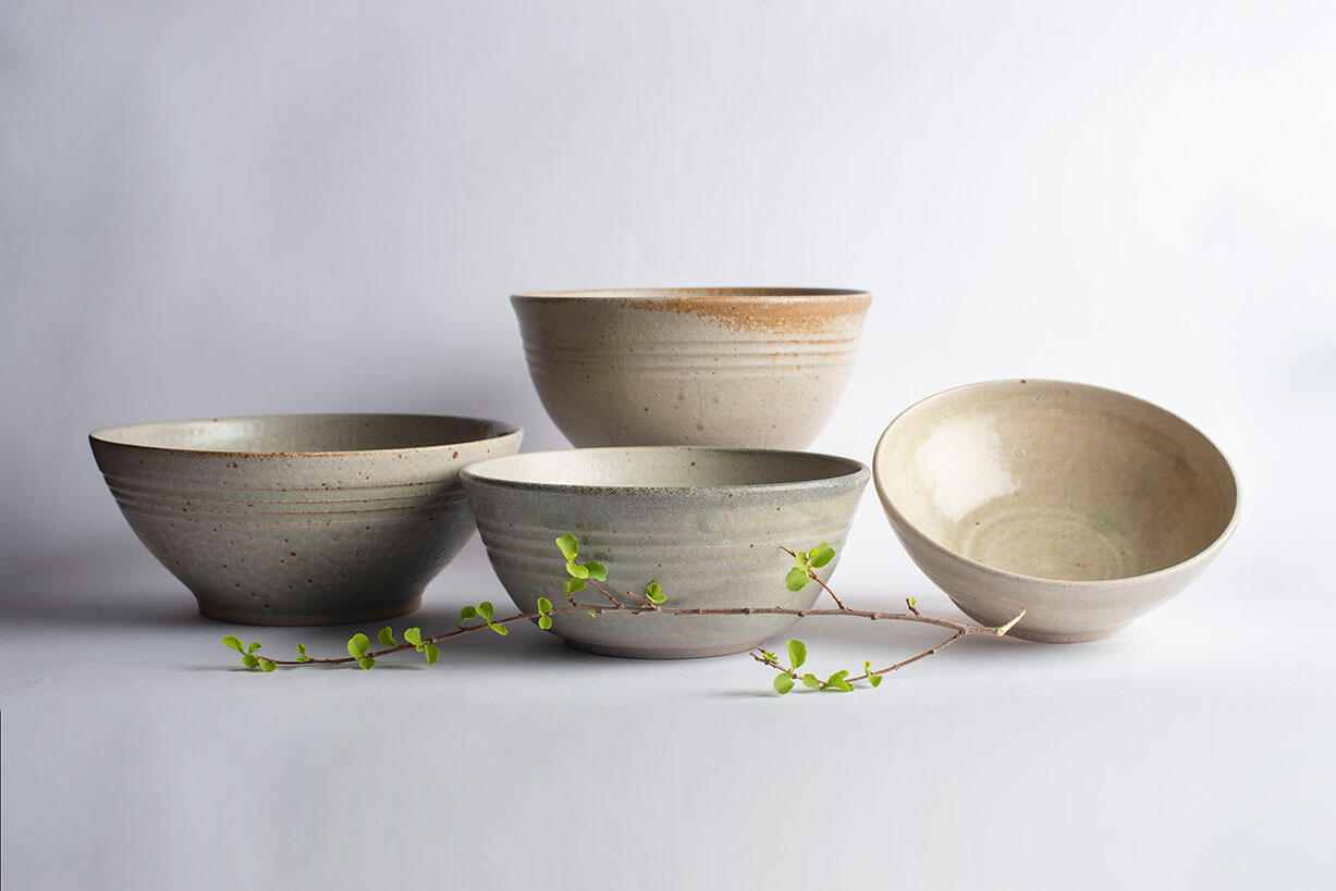 two grey glazed mugs