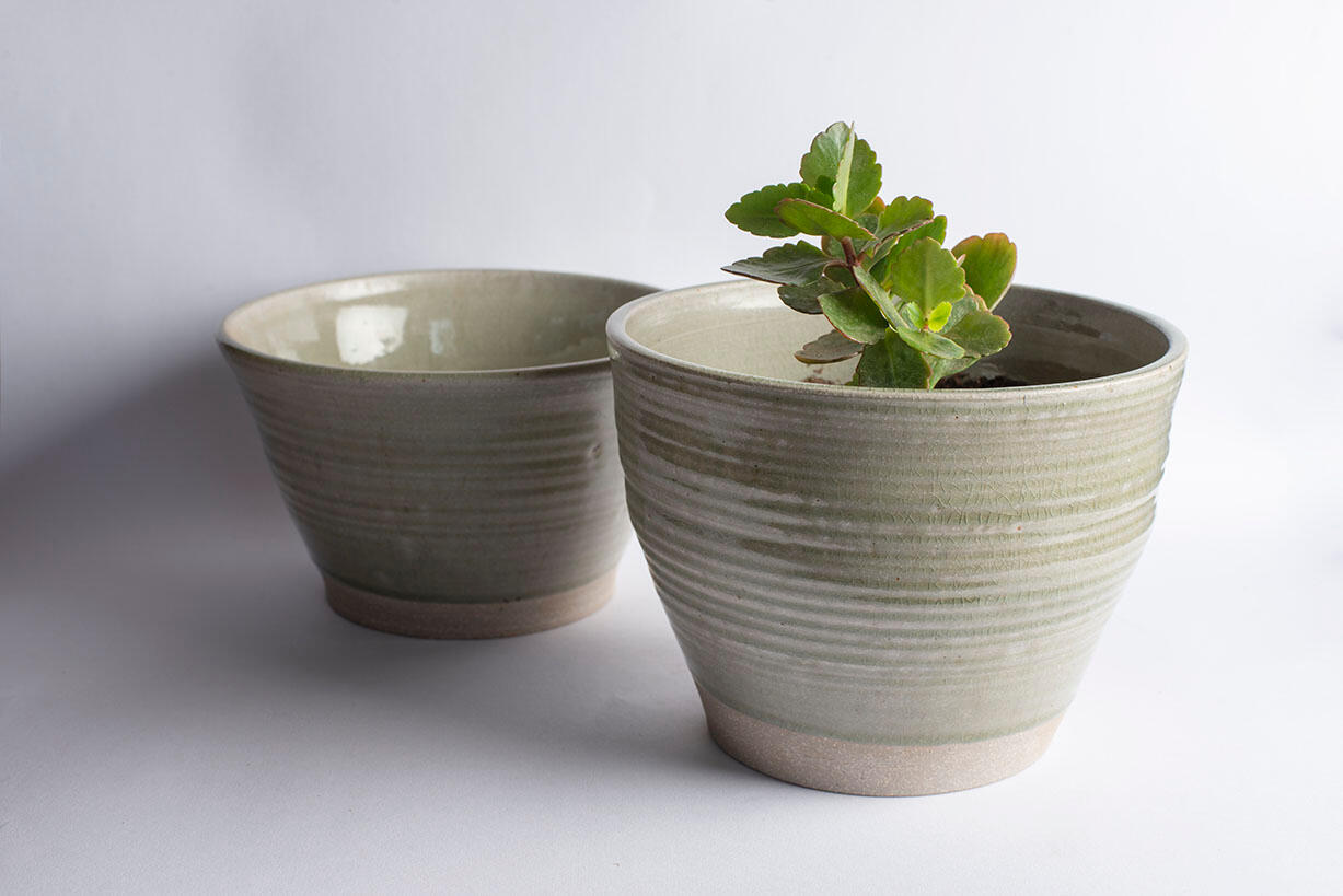 two grey glazed mugs